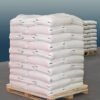 White polypropylene sacks at transport pallet Potassium Bicarbonate Food Grade 25kg bag